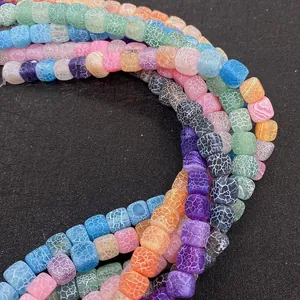 Macro shot of colorful 8mm cube weathered agate beads with crackle texture for DIY jewelry