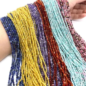 Macro view of multi-color 2mm-3mm faceted natural stone beads strings on model arm