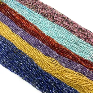 Macro view of multi-color 2-4mm faceted tiger eye and amethyst beads for jewelry