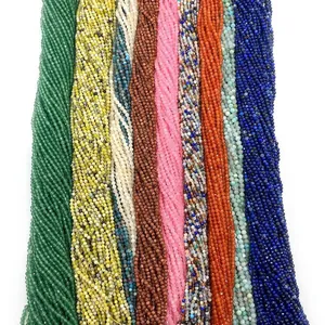Macro detail of 2mm faceted multi-color gemstone beads strings for DIY jewelry making