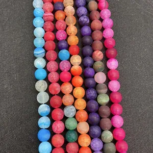 Macro shot of colorful dragon vein agate stone beads with matte texture and unique cracks