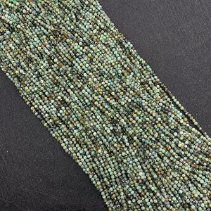 Macro detail of faceted natural African turquoise beads showing organic textures and green tones