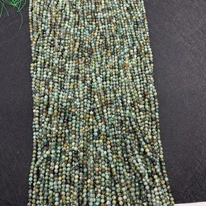 Detailed macro view of faceted African turquoise beads with natural green textures