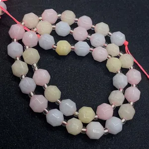 Macro shot of faceted Morganite gemstone beads in pastel pink and purple colors