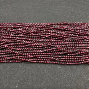 Detailed close-up of natural garnet faceted beads in deep red for DIY jewelry making