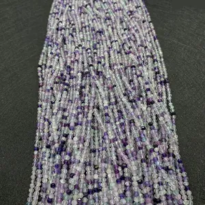 Macro detail of faceted natural purple amethyst and green gemstone beads for jewelry making