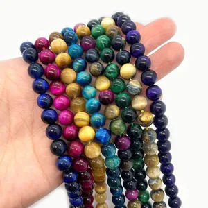 Multiple colors of natural tiger eye stone beads strings showing cat eye flash effect