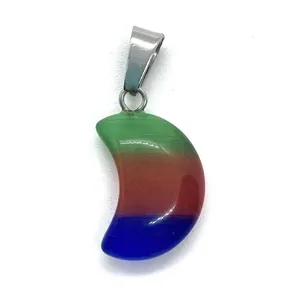 Macro shot of moon-shaped crescent pendant with colorful cat eye stone and metal clasp