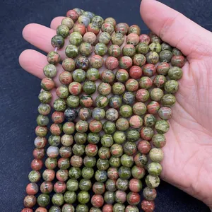 Macro detail of natural green unakite stone beads for DIY jewelry making and crafts