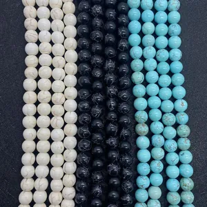 Macro view of assorted turquoise and marble texture round beads for jewelry making