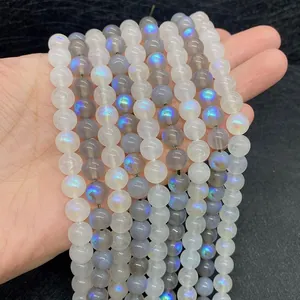 Detailed view of moonstone beads with blue fire effect for jewelry making projects
