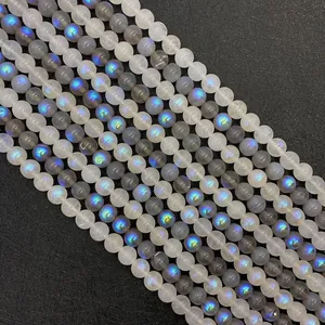 Detailed macro view of 6-8mm labradorite and moonstone beads with iridescent blue flash