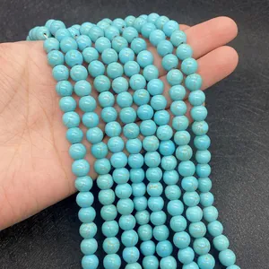 Close-up of sky blue turquoise beads with natural brown matrix for DIY jewelry making