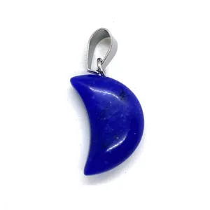 Deep blue lapis crescent moon pendant with silver bail on a clean white background