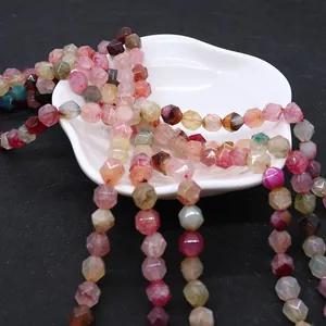 Close-up of colorful faceted dragon vein agate loose beads for DIY jewelry making