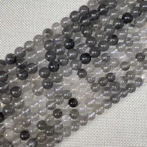 Perle in quarzo rutilato naturale lucido con inclusioni per la creazione di gioielli