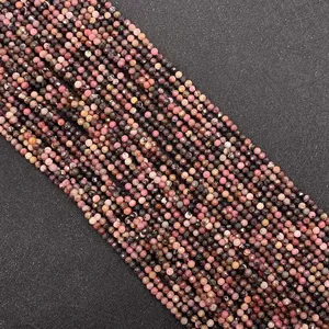 Macro detail of 2-3mm faceted pink Rhodonite stone beads for DIY jewelry making