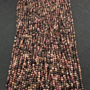 Macro view of 2-4mm faceted natural stone round beads in multi-color pink and brown