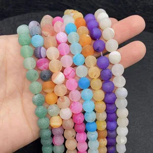 Macro shot of 6-10mm matte natural agate beads with various vibrant colors and frosted texture