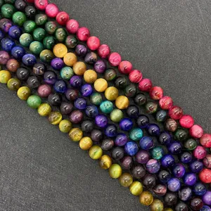 Macro view of polished colorful tiger eye stone beads with silk luster for DIY jewelry