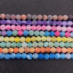 Macro shot of colorful dragon vein agate beads with unique spider web crackle patterns