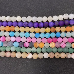Macro shot of sorted matte natural agate beads with frosted texture for DIY jewelry