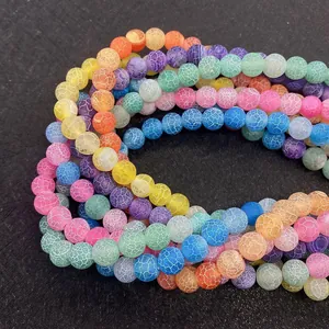 Macro detail of multicolored dragon vein agate beads with unique crackle patterns
