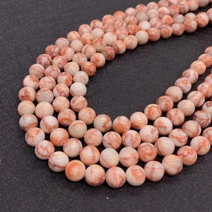 Macro shot of 6-10mm red network natural stone beads with marble texture for DIY jewelry