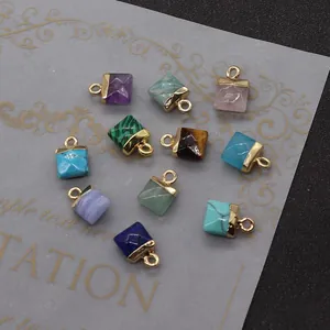 Close-up of square natural stone pendants with gold bail for DIY jewelry making