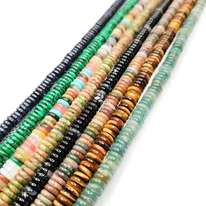 Macro view of assorted 2x6mm natural stone flat beads including malachite and lapis