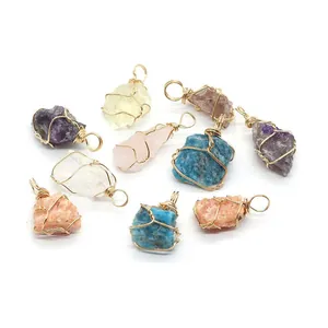 Handmade wire-wrapped natural crystal stone pendants in assorted colors with gold wire loops