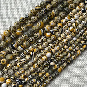 Natural round malachite style beads with yellow black white swirl texture for jewelry