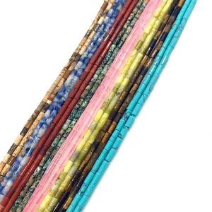 Close-up of cylinder tube stone beads in tiger eye and turquoise for DIY jewelry
