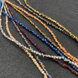 Detailed macro view of irregular metallic plated natural stone beads in vibrant colors