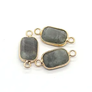 Detailed view of rectangular grey labradorite connectors with gold plated bezels