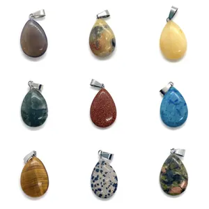 Macro shot of 9 teardrop natural stone pendants with silver clasps in a 3x3 layout