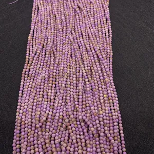 Macro shot of 2-4mm faceted purple mica natural stone beads for DIY jewelry making