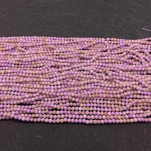 Macro detail of faceted natural purple stone beads with mineral textures for jewelry DIY