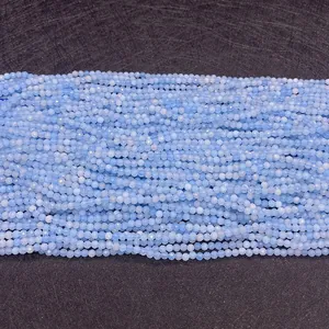 Close-up of faceted light blue apatite round beads for DIY jewelry making accessories
