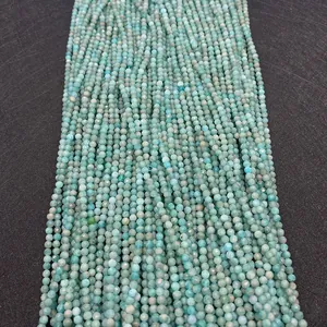 Macro view of faceted natural amazonite stone beads in rows for jewelry making