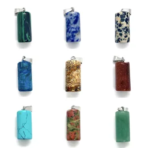 Macro detail of nine various natural stone cylinder pendants with silver metal clasps