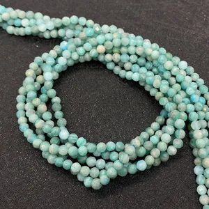 Macro shot of faceted natural amazonite round beads for DIY jewelry making