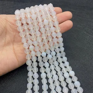 Macro shot of faceted white agate beads showing detailed diamond-cut surface for DIY crafts