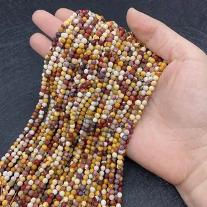 Close-up of faceted natural stone round beads in multi-color for jewelry DIY making