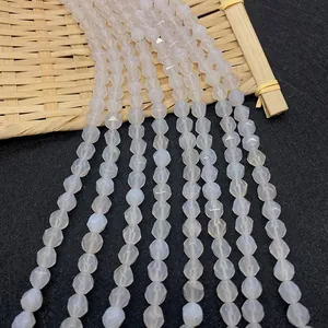 Detailed view of faceted lavender and white agate beads strand on a textured bamboo mat