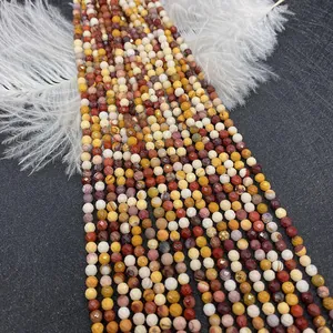 Detailed macro view of faceted natural yellow stone beads on a textured grey surface
