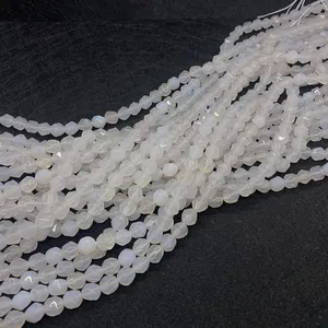 Macro view of multi-faceted white agate beads for DIY jewelry making and crafts