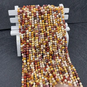 Close-up of 2-4mm faceted mookaite jasper natural stone beads for DIY jewelry making