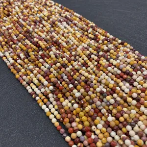 Macro shot of faceted mookaite jasper beads showing natural color texture and shine