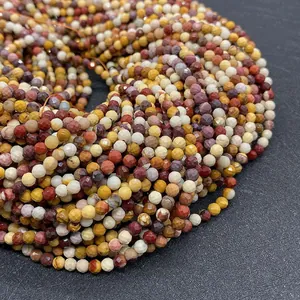 Macro shot of 2-4mm faceted natural stone beads with warm earth tones for DIY jewelry